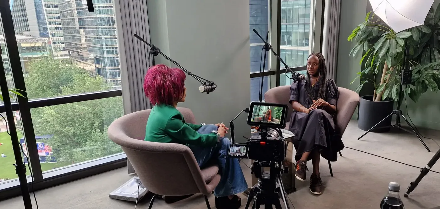 Pearl and Alayo Akinkugbe filming an episode of The Pearl Lam Podcast